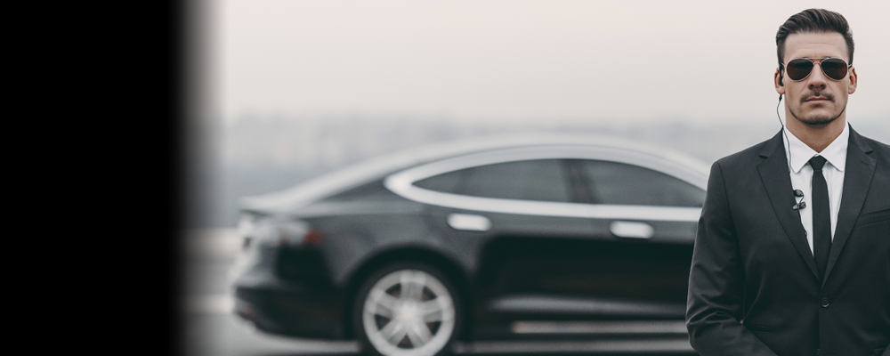 Black limo with suited man